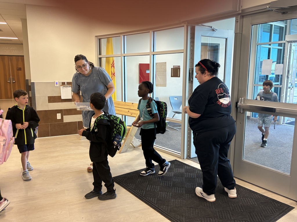staff greeting students