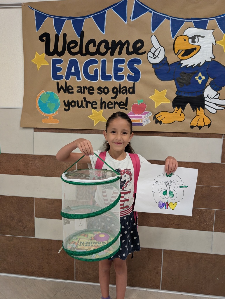 student holding butterfly habitat