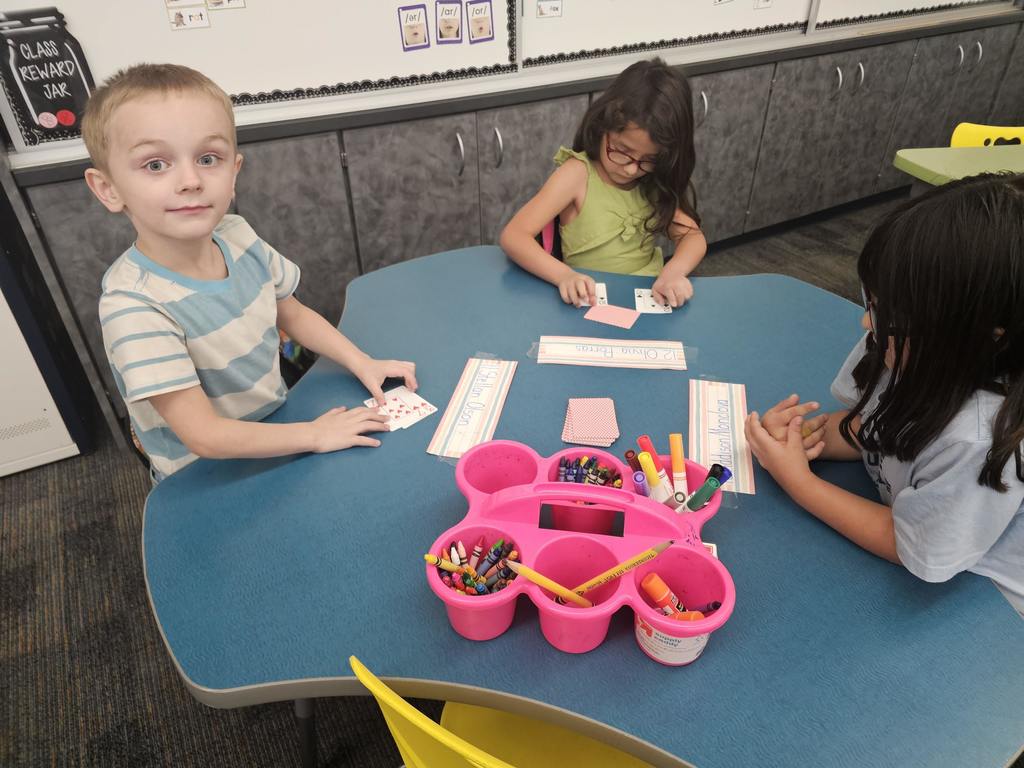 1st grade students with cards