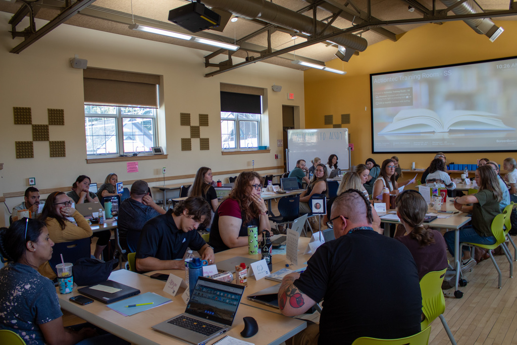 New teachers gathered in a training room