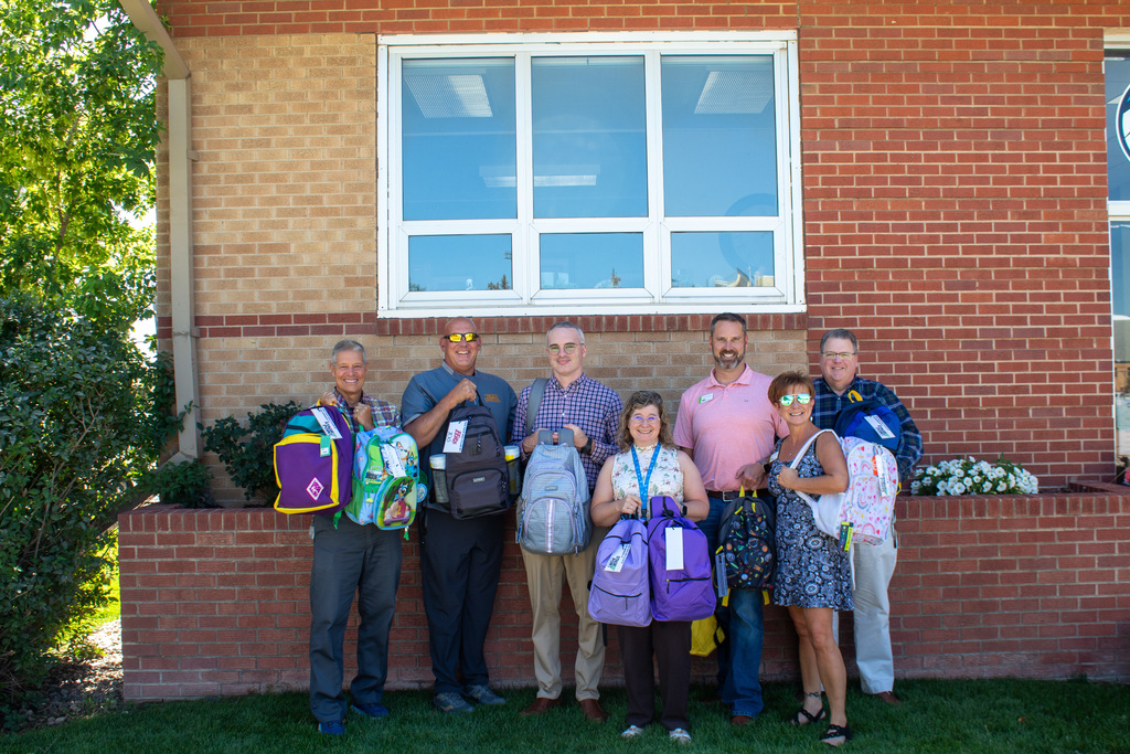 Community members gathered to showcase backpacks donated to the school district