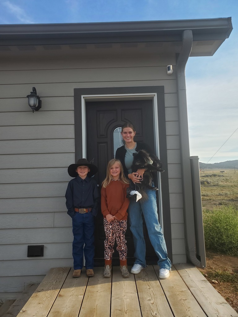 Antelope Creek students and teacher outside of their classroom