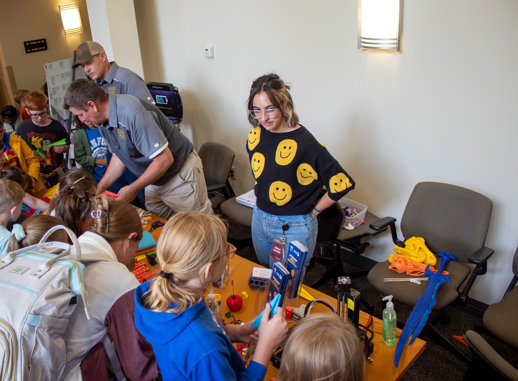 Students playing with hands on learning tools