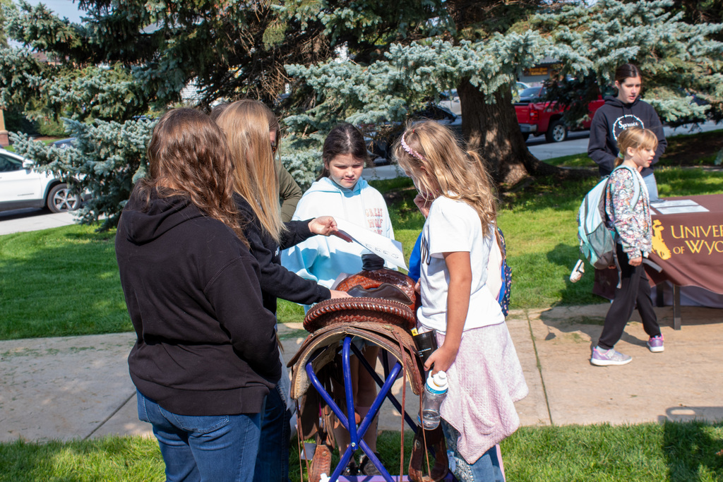 students learning about horseback riding tack