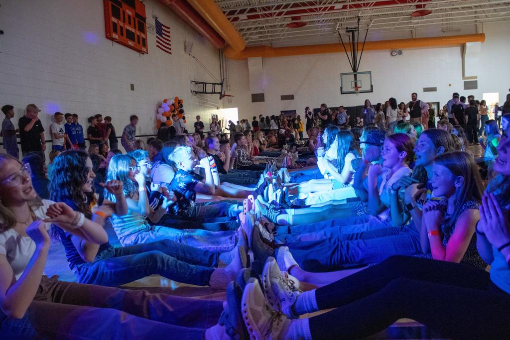 Students dancing in middle school gymnasium