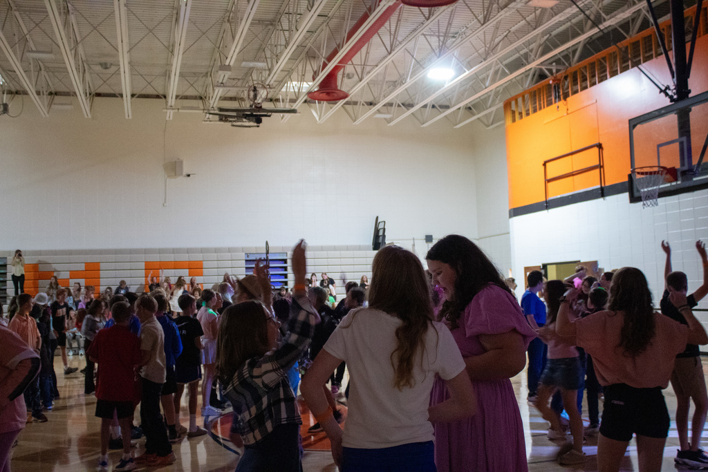 Students dancing in middle school gymnasium