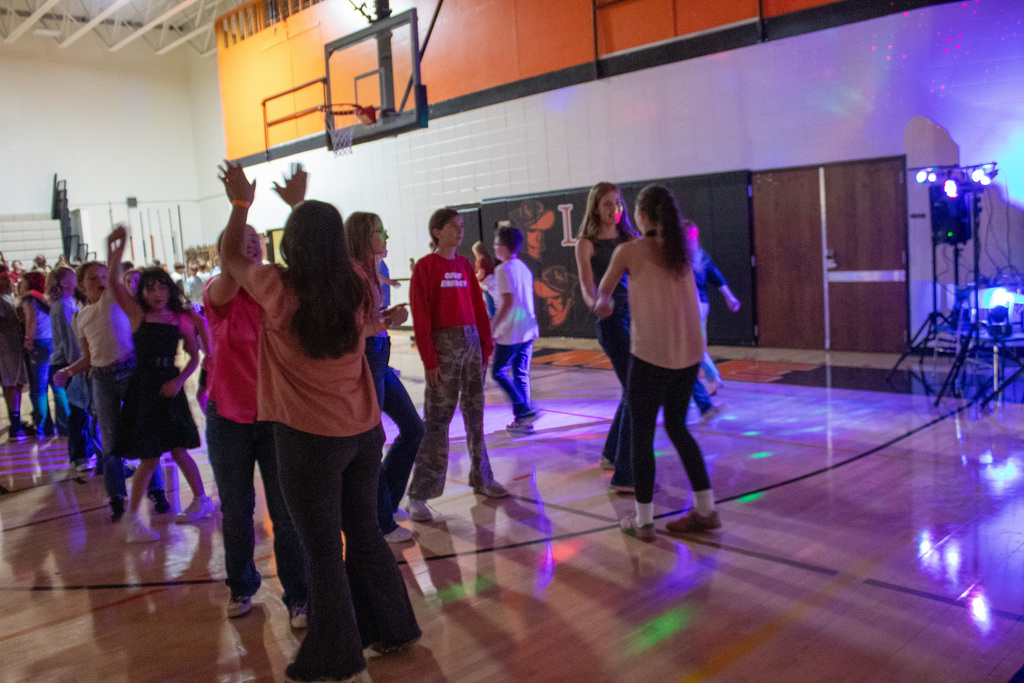 Students dancing in middle school gymnasium