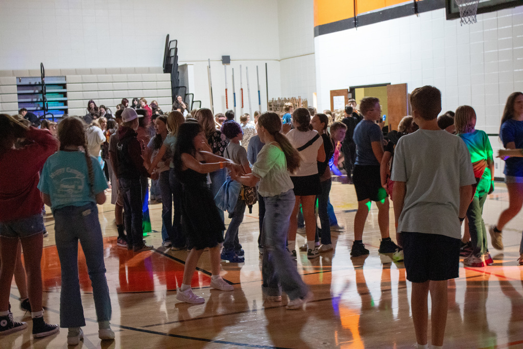 Students dancing in middle school gymnasium