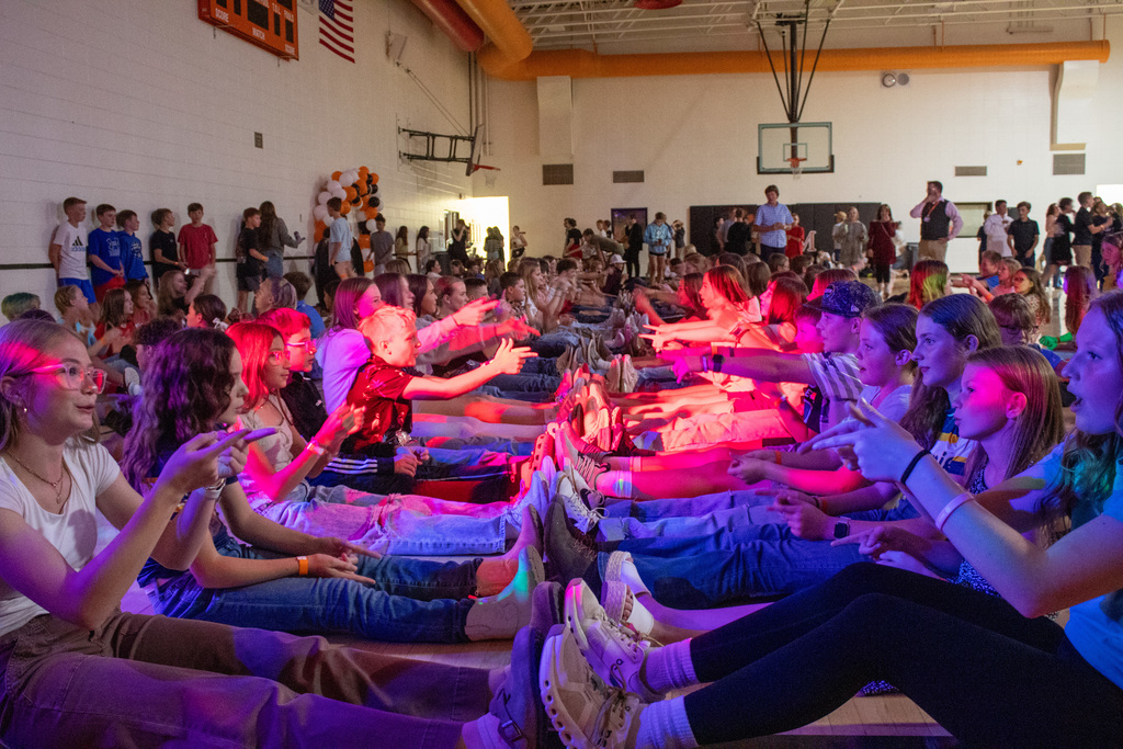 Students dancing in middle school gymnasium