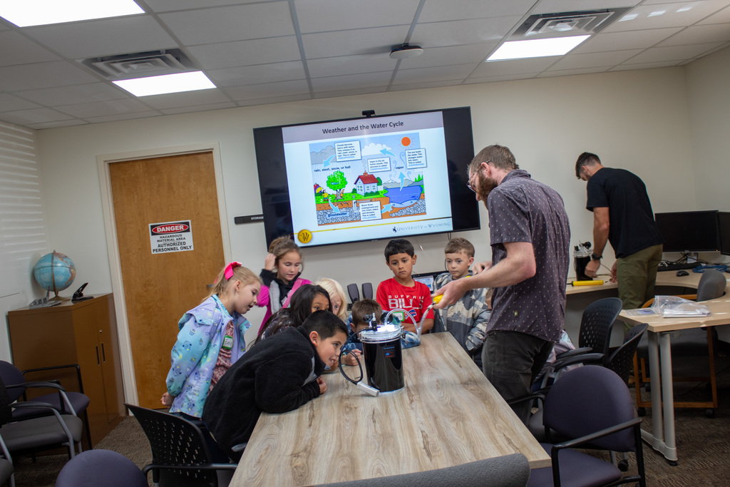 Students learning from UW professors and students 