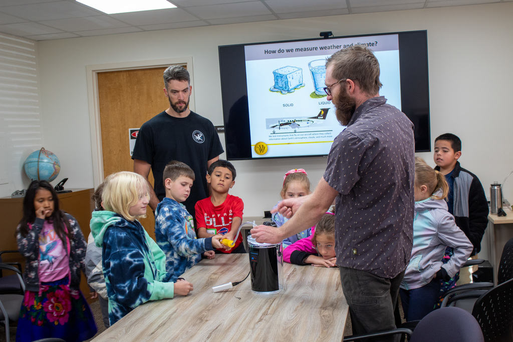 Students learning from UW professors and students 