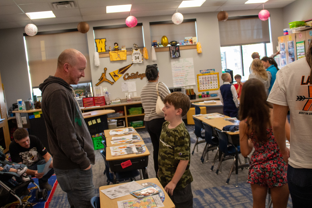 Student visiting with new teacher