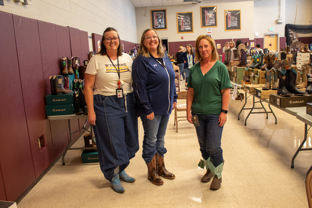 Three women posing with their new boots