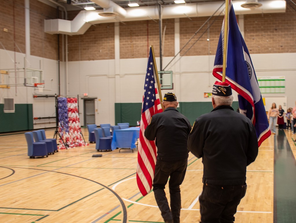 Veterans presenting the flag at school assembly