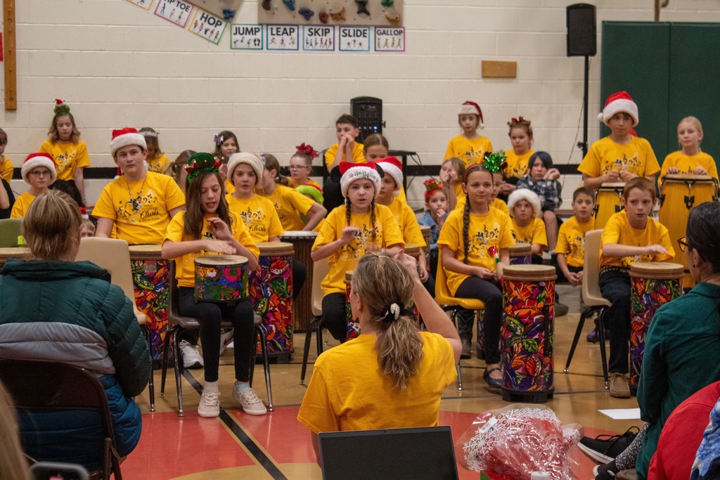 Students playing in a drum circle