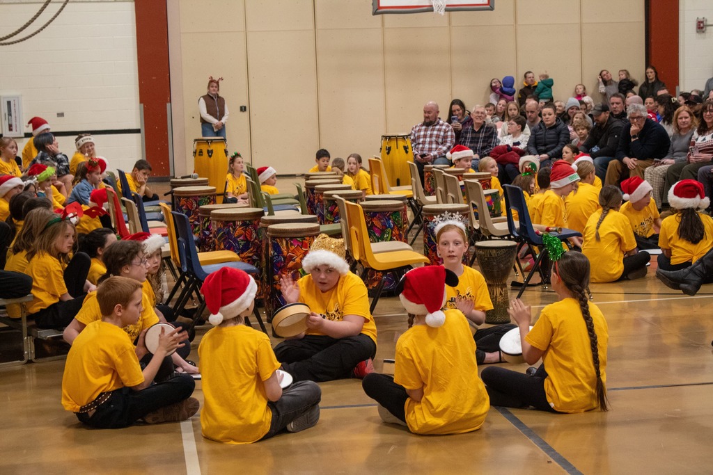 Students playing in a drum circle