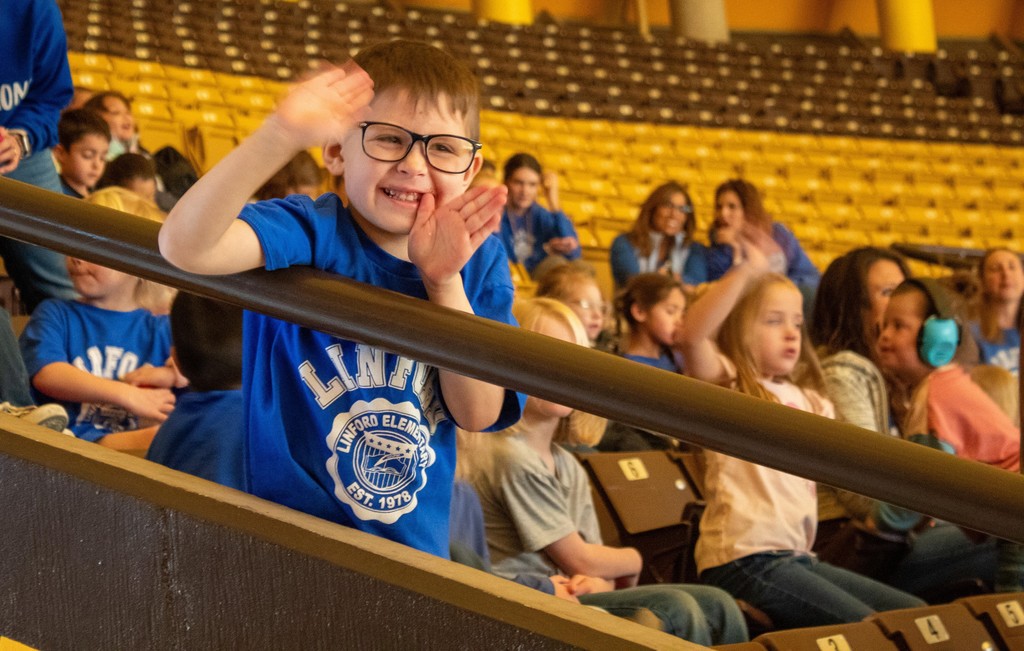 Students sitting in stands watching UW Girls Basketball Game