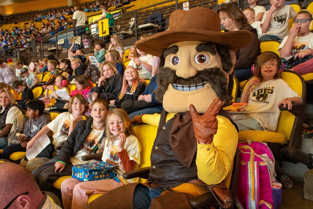 Students sitting in stands watching UW Girls Basketball Game