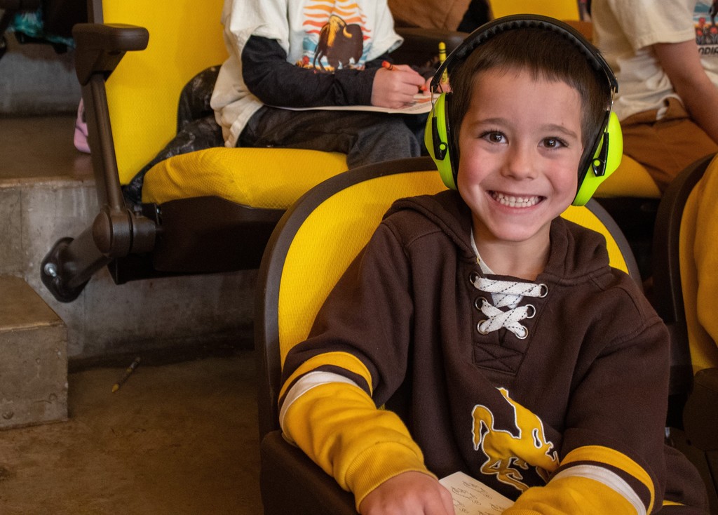 Students sitting in stands watching UW Girls Basketball Game