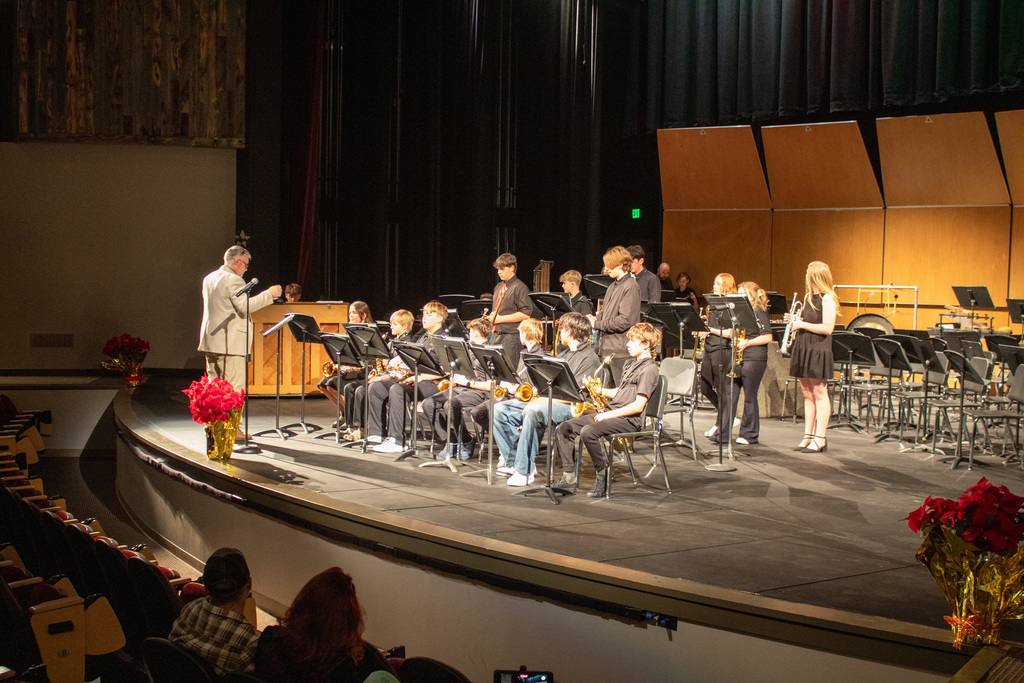 middle school band students performing on stage