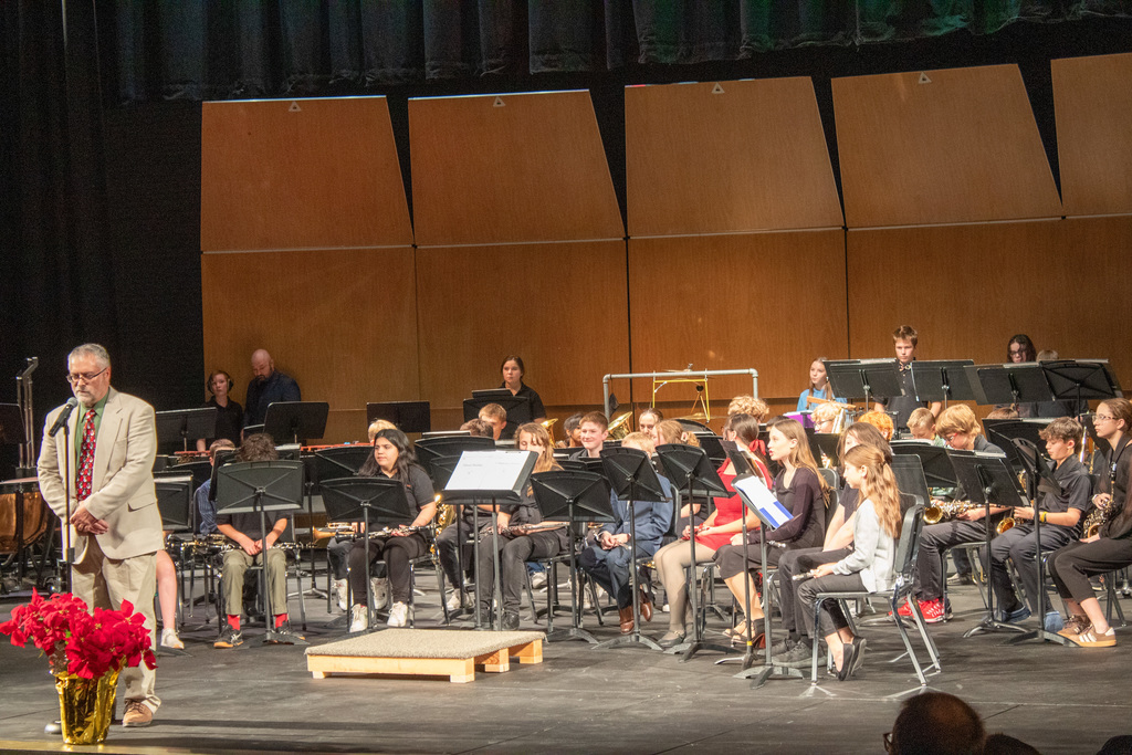 middle school band students performing on stage