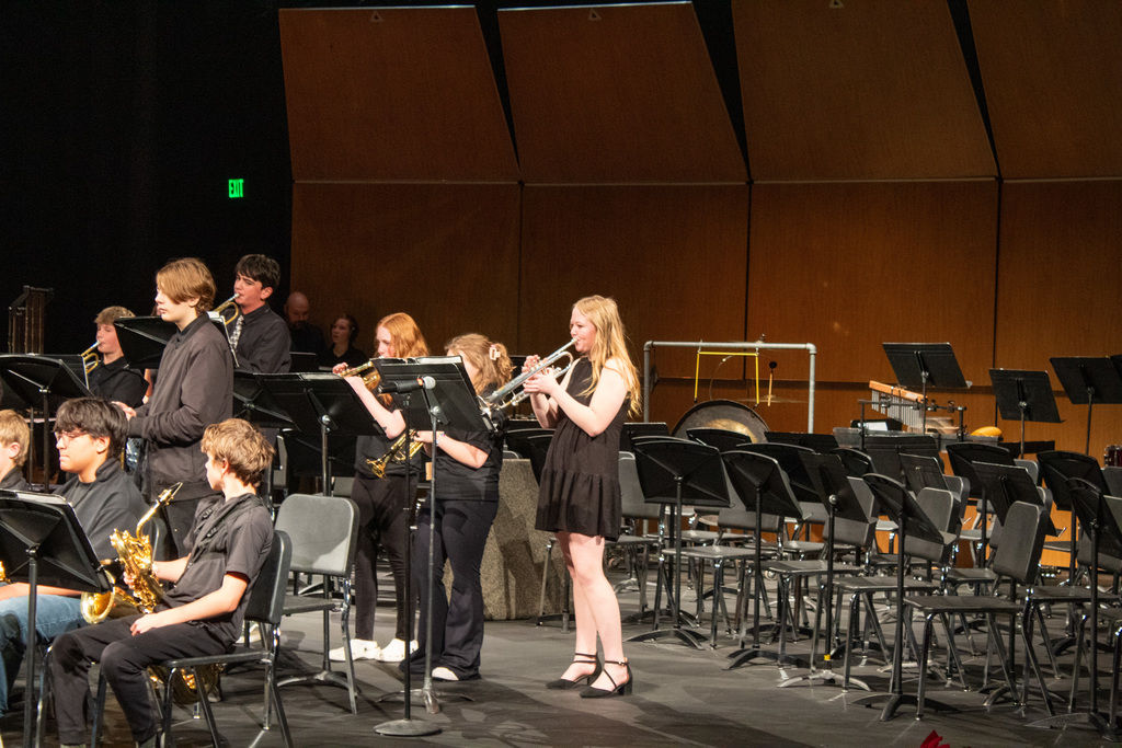 middle school band students performing on stage
