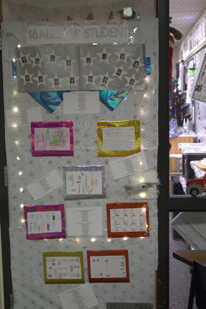 Door decorated in student work and lights