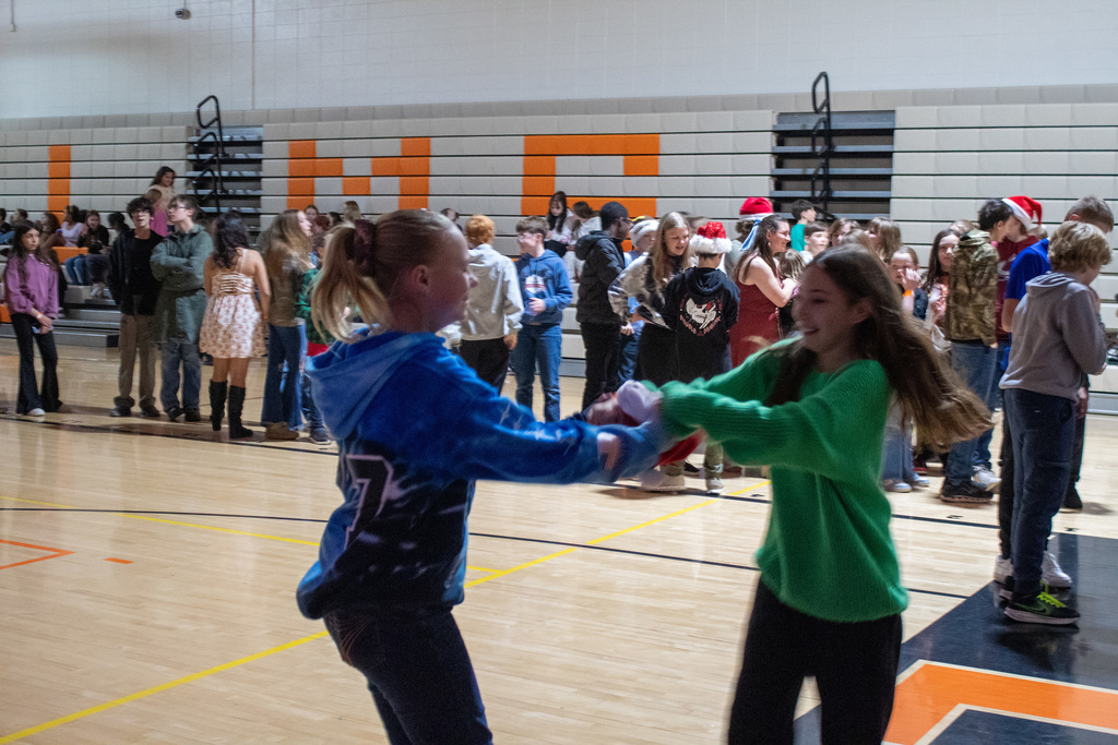 Middle School students dancing in the gym