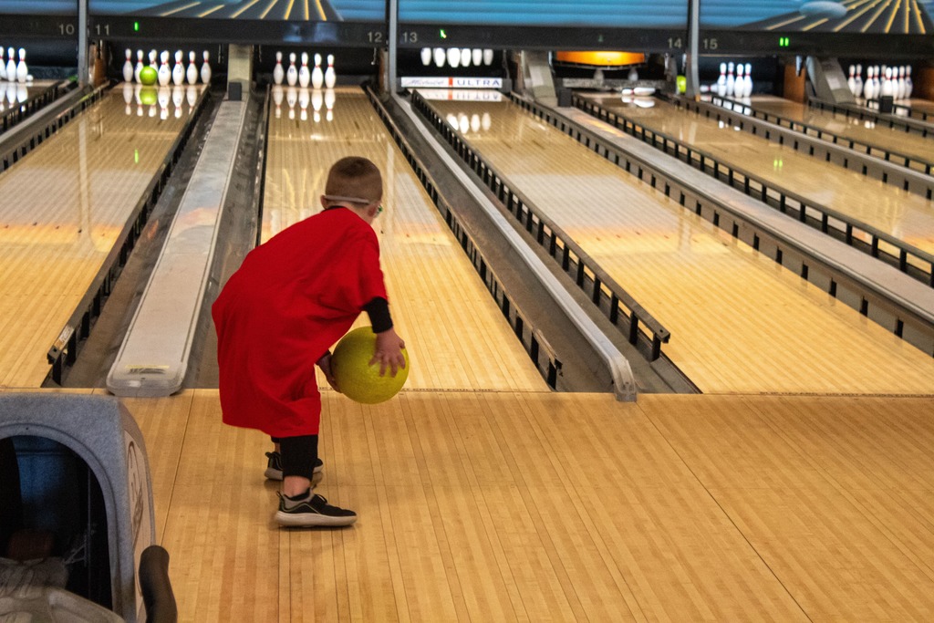 student throwing bowling ball