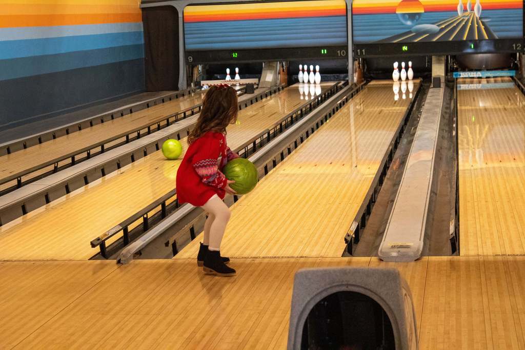 student throwing bowling ball