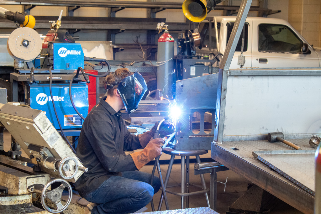 student working in the shop