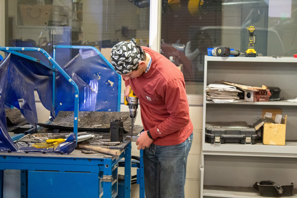 student working in the shop