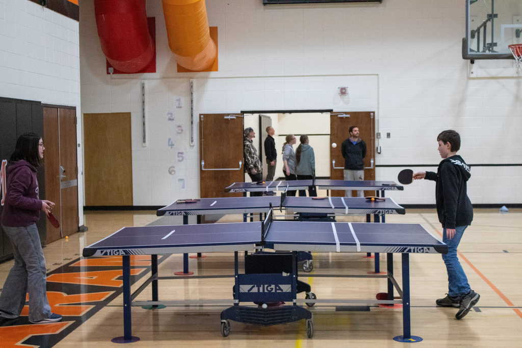 Two students playing table tennis