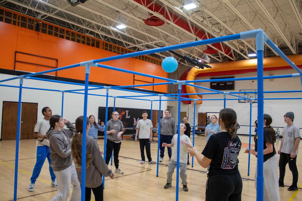 Students tossing a balll between each other