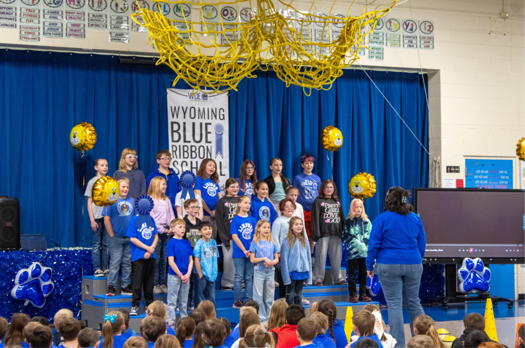Student choir performing for audience