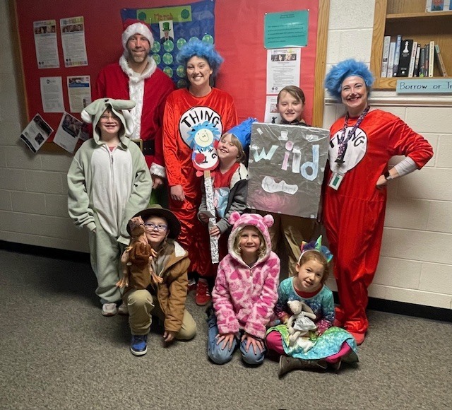 Students and teacher dressed in a dr.suess costume