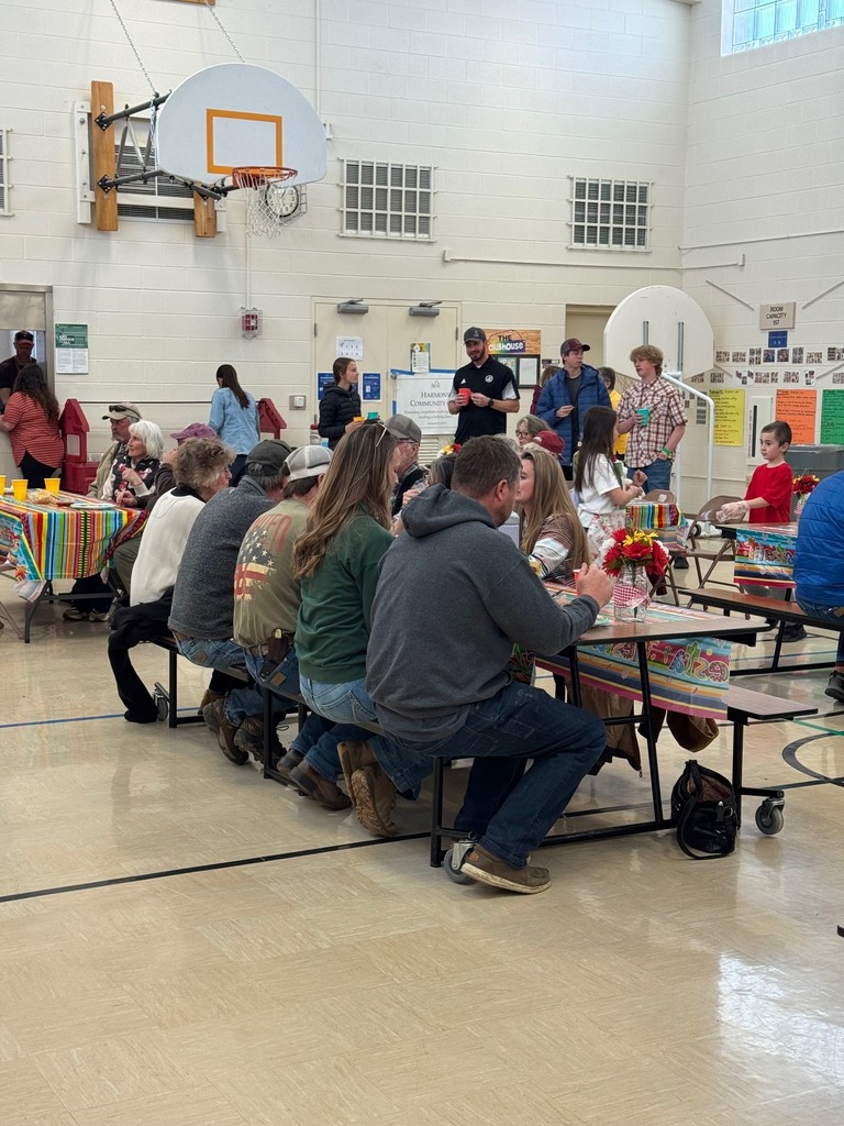 Groups of people sitting around tables and talking