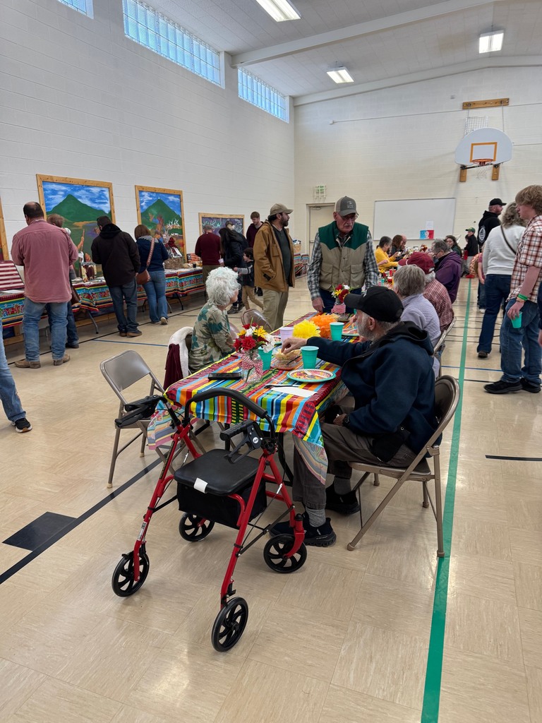 Groups of people sitting around tables and talking