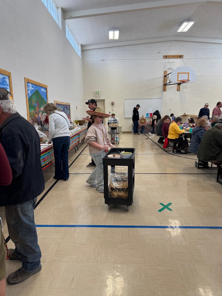Groups of people sitting around tables and talking