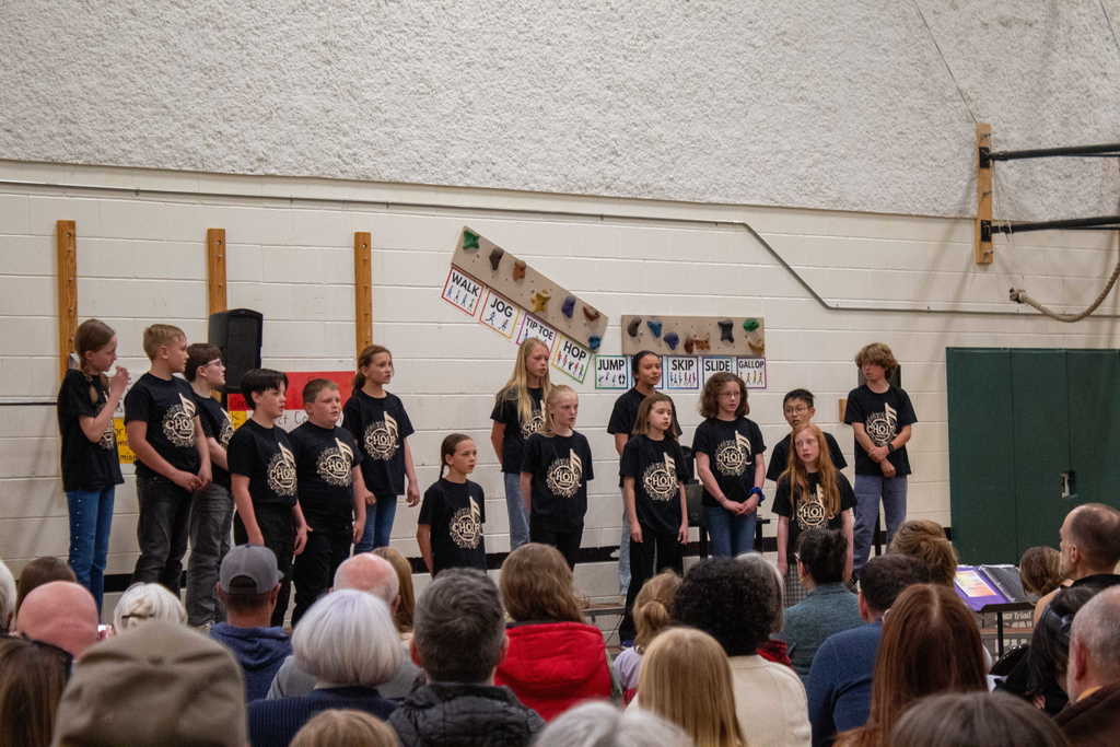 Choir students standing on stage