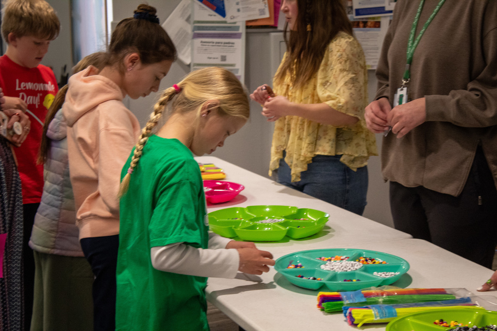Young girls lined up to pick our bracelet charms