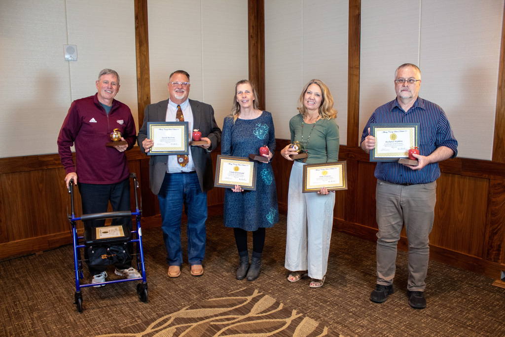 Group of men and women holding certificates 