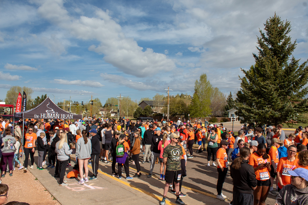 Crowd of people gathered at the start line of a race