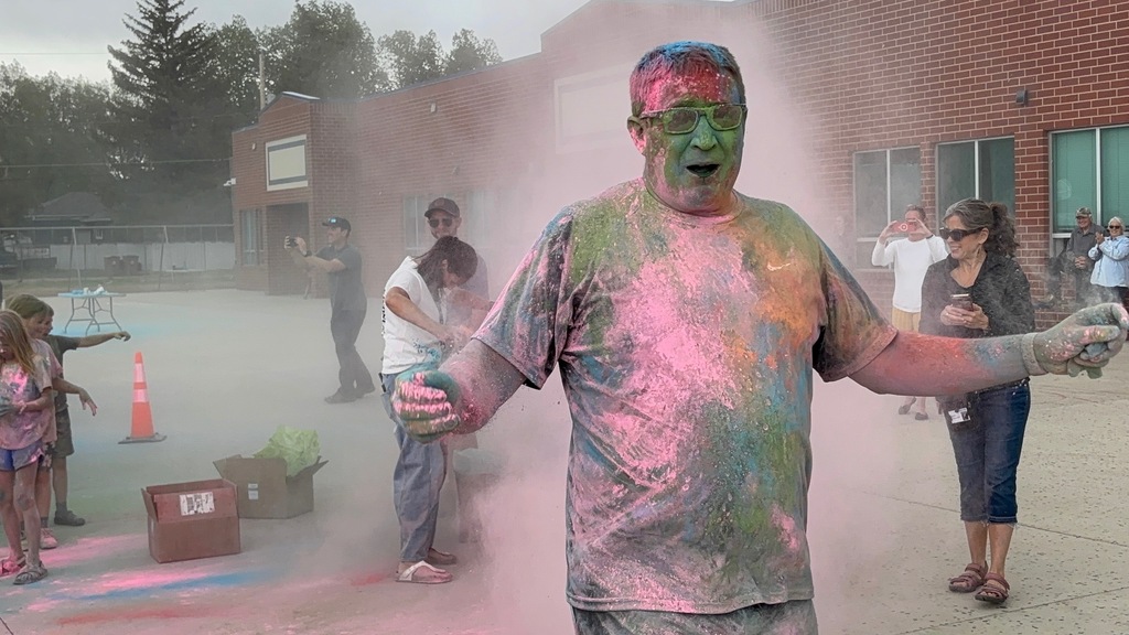 Man covered in colored powder