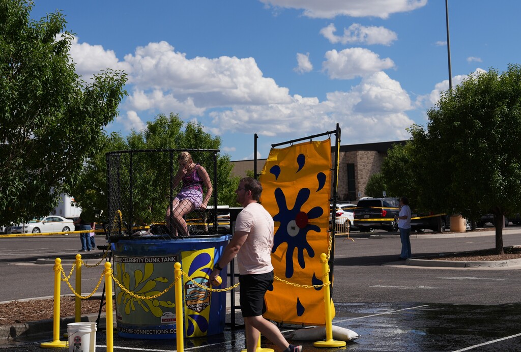 Dunk tank with a girl sitting in the middle