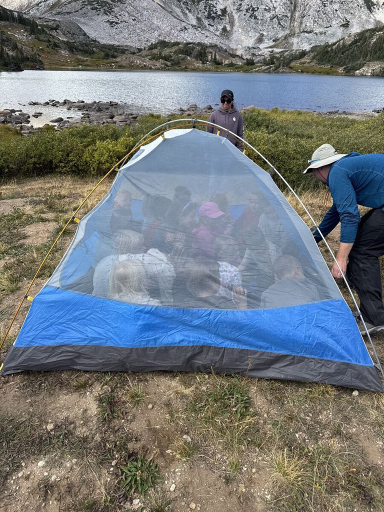 Students gathered in a tent