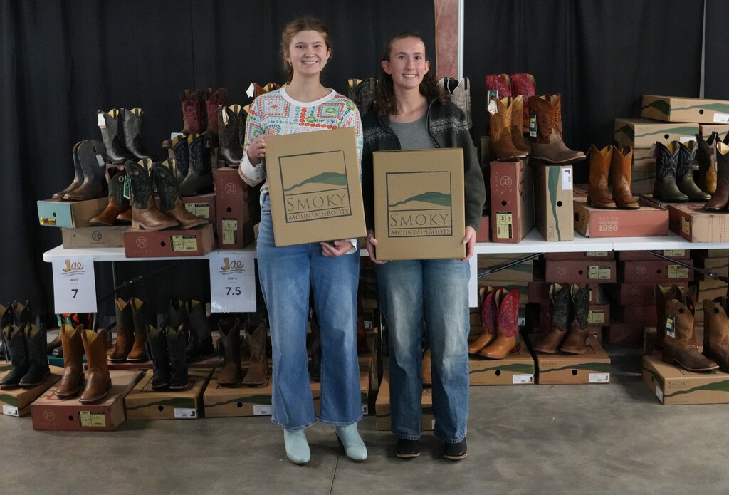 two girls in new boots smiling for the camera