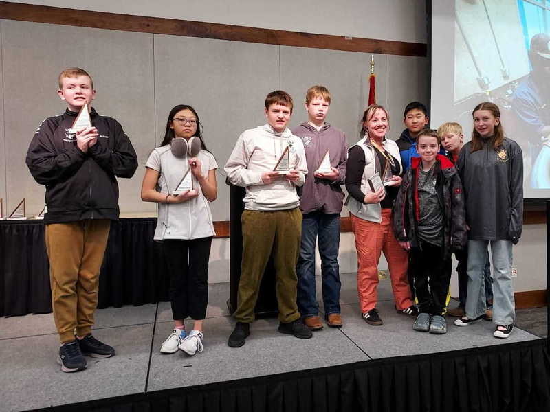 Young female with long light brown hair dressed in jeans and jacket