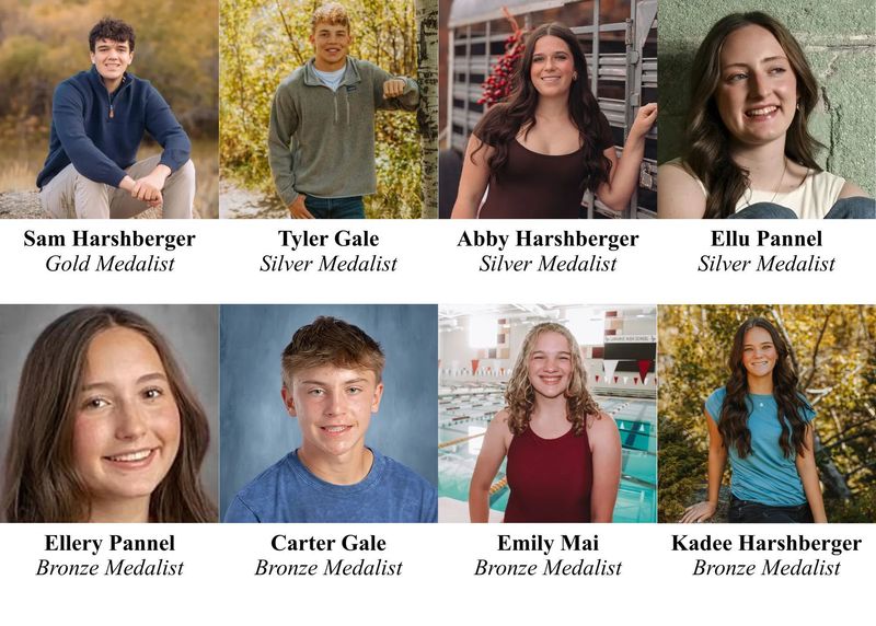 middle school students posing in doorway with teacher