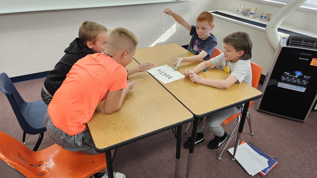 Drawing with strings attached to markers